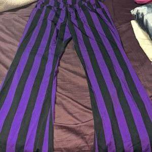 Size M polyester pants. Purple and black striped.